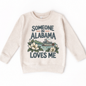 Someone in Alabama Loves Me design on a natural beige sweatshirt