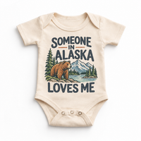 Someone in Alaska Loves Me design on a natural beige baby bodysuit