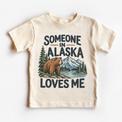 Someone in Alaska Loves Me design on a natural beige short sleeve T-shirt