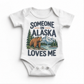 Someone in Alaska Loves Me design on a white baby bodysuit
