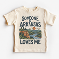 Someone in Arkansas Loves Me design on a natural beige short sleeve T-shirt