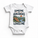 Someone in Arkansas Loves Me design on a white baby bodysuit