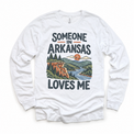 Someone in Arkansas Loves Me design on a white long sleeve T-shirt