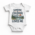 Someone in Colorado Loves Me design on a white baby bodysuit