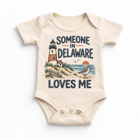 Someone in Delaware Loves Me design on a natural beige baby bodysuit