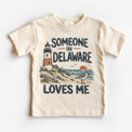 Someone in Delaware Loves Me design on a natural beige short sleeve T-shirt
