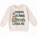Someone in Delaware Loves Me design on a natural beige sweatshirt