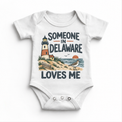 Someone in Delaware Loves Me design on a white baby bodysuit