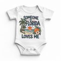 Someone in Florida Loves Me design on a white baby bodysuit