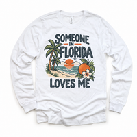 Someone in Florida Loves Me design on a white long sleeve T-shirt