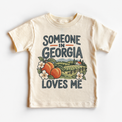 Someone in Georgia Loves Me design on a natural beige short sleeve T-shirt