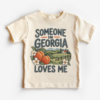 Someone in Georgia Loves Me design on a natural beige short sleeve T-shirt