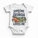 Someone in Georgia Loves Me design on a white baby bodysuit