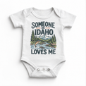 Someone in Idaho Loves Me design on a white baby bodysuit