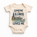 Someone in Illinois Loves Me design on a natural beige baby bodysuit