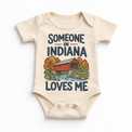 Someone in Indiana Loves Me design on a natural beige baby bodysuit