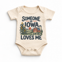 Someone in Iowa Loves Me design on a natural beige baby bodysuit