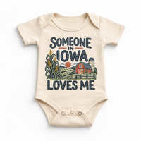 Someone in Iowa Loves Me design on a natural beige baby bodysuit