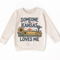 Someone in Kansas Loves Me design on a natural beige sweatshirt