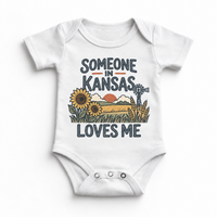 Someone in Kansas Loves Me design on a white baby bodysuit