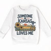 Someone in Kansas Loves Me design on a white sweatshirt