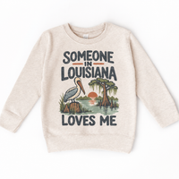 Someone in Louisiana Loves Me design on a natural beige sweatshirt