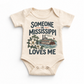 Someone in Mississippi Loves Me design on a natural beige baby bodysuit