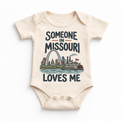 Someone in Missouri Loves Me design on a natural beige baby bodysuit