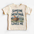 Someone in Montana Loves Me design on a natural beige short sleeve T-shirt