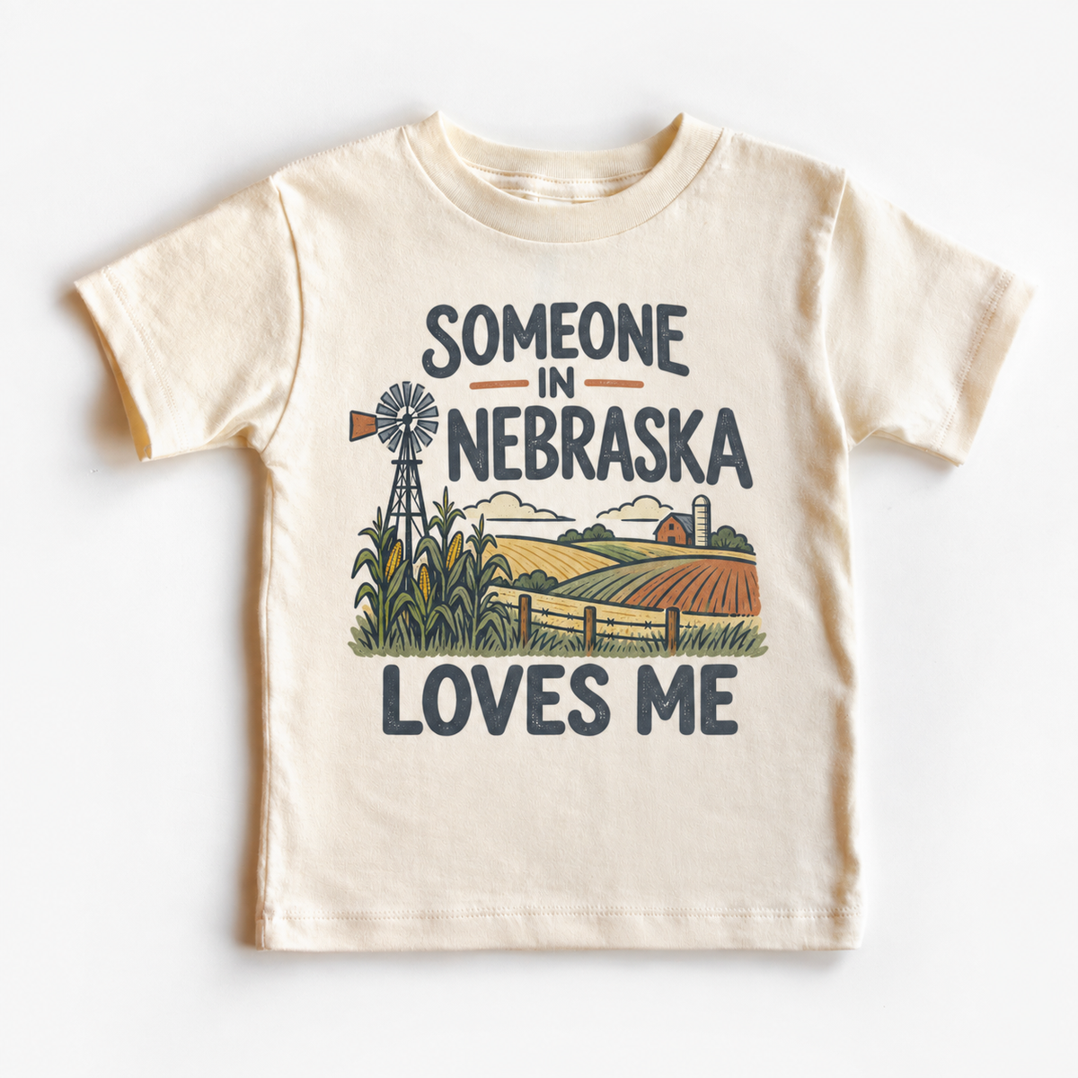 Someone in Nebraska Loves Me design on a natural beige short sleeve T-shirt