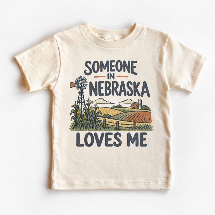Someone in Nebraska Loves Me design on a natural beige short sleeve T-shirt