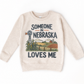 Someone in Nebraska Loves Me design on a natural beige sweatshirt