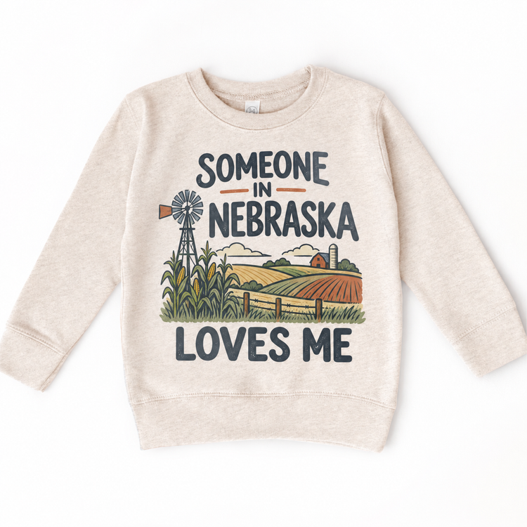 Someone in Nebraska Loves Me design on a natural beige sweatshirt
