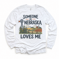Someone in Nebraska Loves Me design on a white long sleeve T-shirt