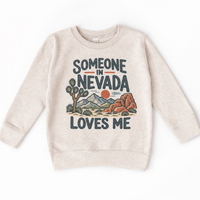 Someone in Nevada Loves Me design on a natural beige sweatshirt