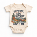 Someone in New Hampshire Loves Me design on a natural beige baby bodysuit