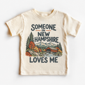 Someone in New Hampshire Loves Me design on a natural beige short sleeve T-shirt