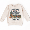 Someone in New Hampshire Loves Me design on a natural beige sweatshirt