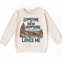 Someone in New Hampshire Loves Me design on a natural beige sweatshirt