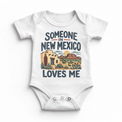 Someone in New Mexico Loves Me design on a white baby bodysuit