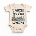 Someone in New York Loves Me design on a natural beige baby bodysuit