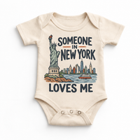 Someone in New York Loves Me design on a natural beige baby bodysuit