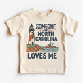 Someone in North Carolina Loves Me design on a natural beige short sleeve T-shirt
