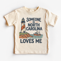 Someone in North Carolina Loves Me design on a natural beige short sleeve T-shirt