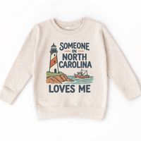 Someone in North Carolina Loves Me design on a natural beige sweatshirt