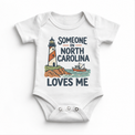 Someone in North Carolina Loves Me design on a white baby bodysuit