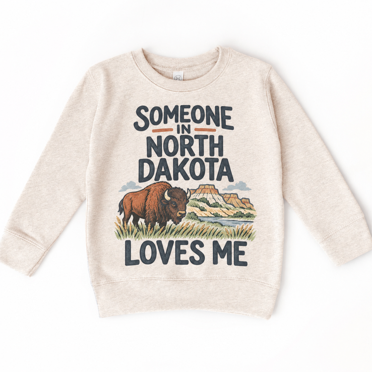 Someone in North Dakota Loves Me design on a natural beige sweatshirt