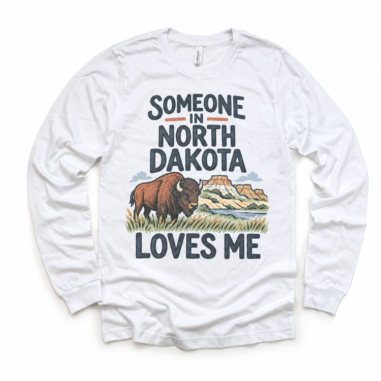 Someone in North Dakota Loves Me design on a white long sleeve T-shirt
