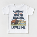 Someone in North Dakota Loves Me design on a white short sleeve T-shirt