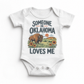 Someone in Oklahoma Loves Me design on a white baby bodysuit